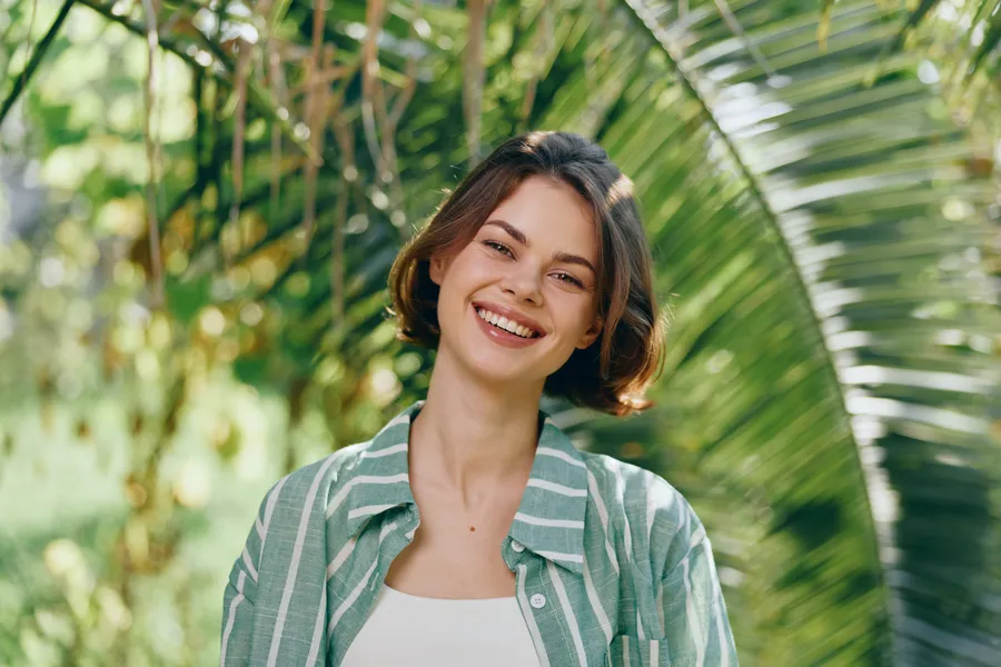 Person smiling while relaxing at home